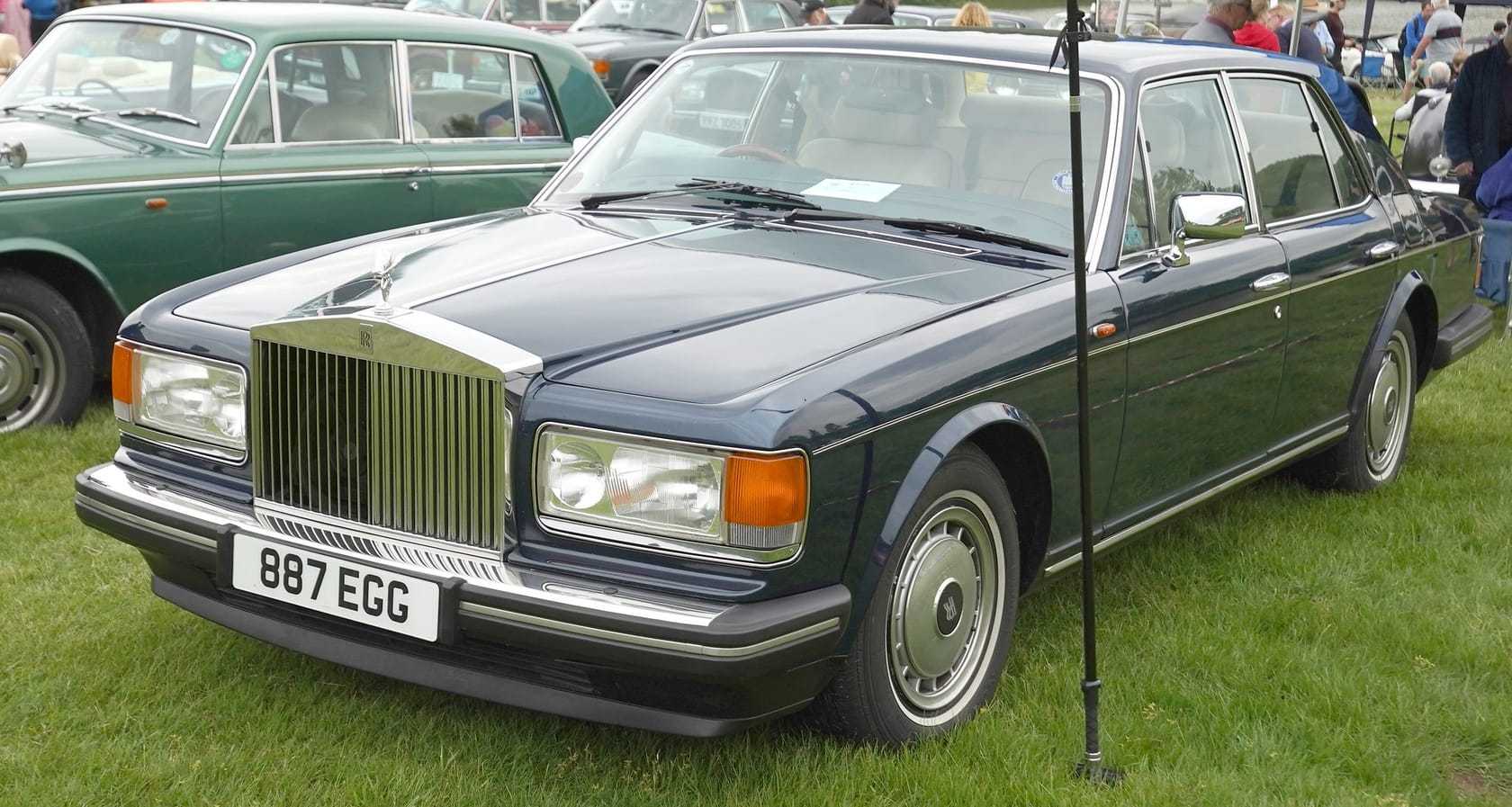 A silver-green Rolls-Royce Silver Spirit II with UK registration 887 EGG at a classic car show