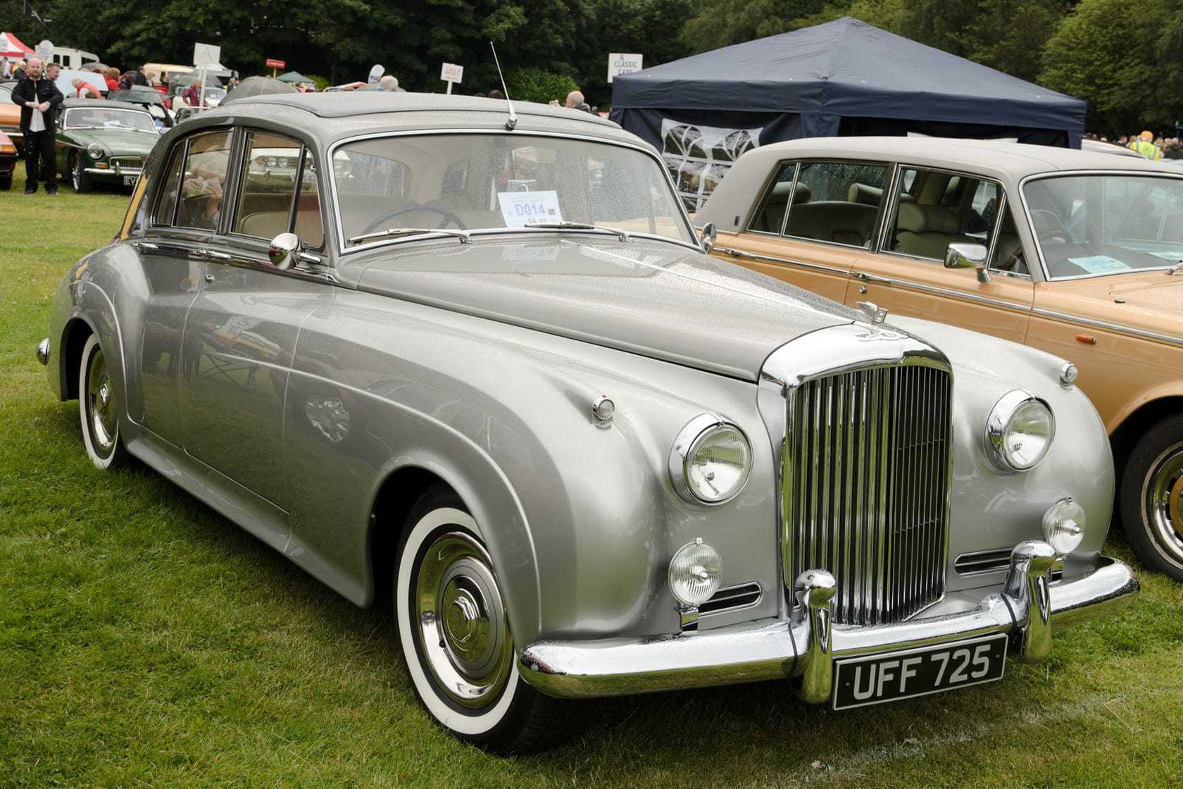 A silver 1957 Bentley S1 with UK registration UFF 725, front three-quarter view at a classic car show