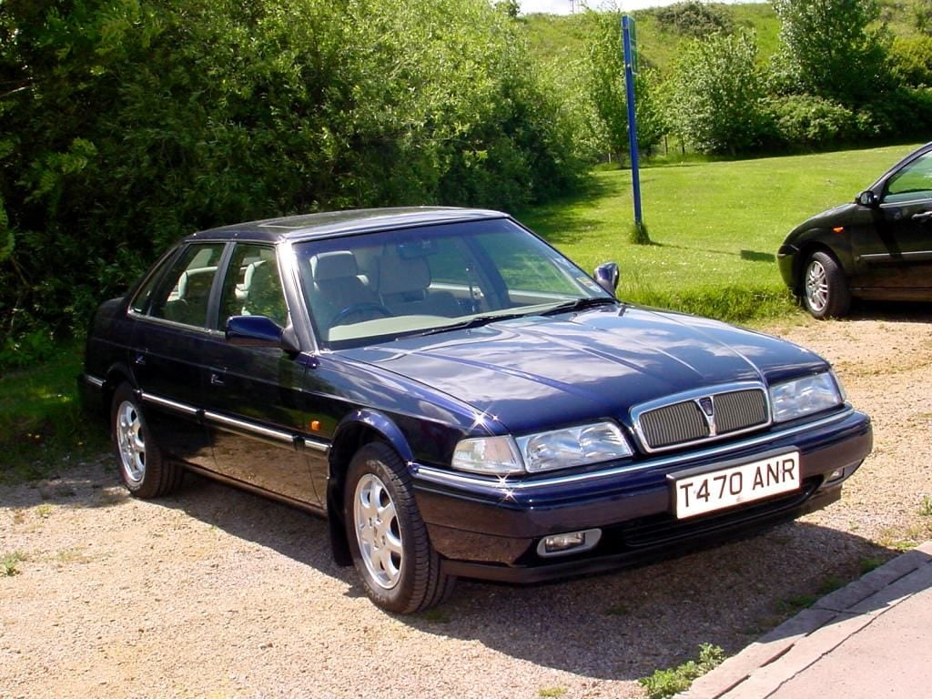 A blue Rover 800 R17 saloon with a UK registration parked on a show field