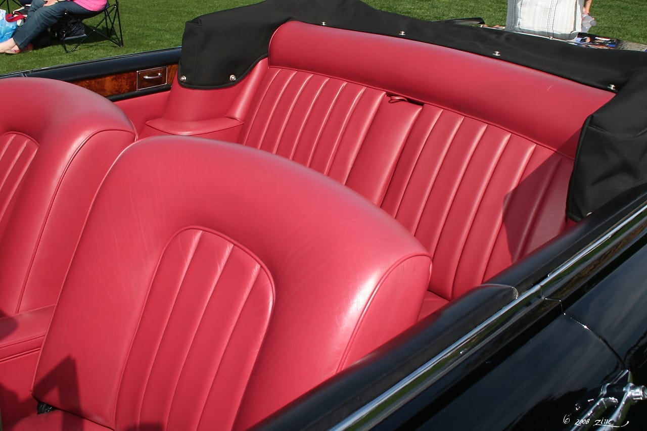 The red leather interior of a 1965 Rolls-Royce Silver Cloud III convertible by Mulliner Park Ward