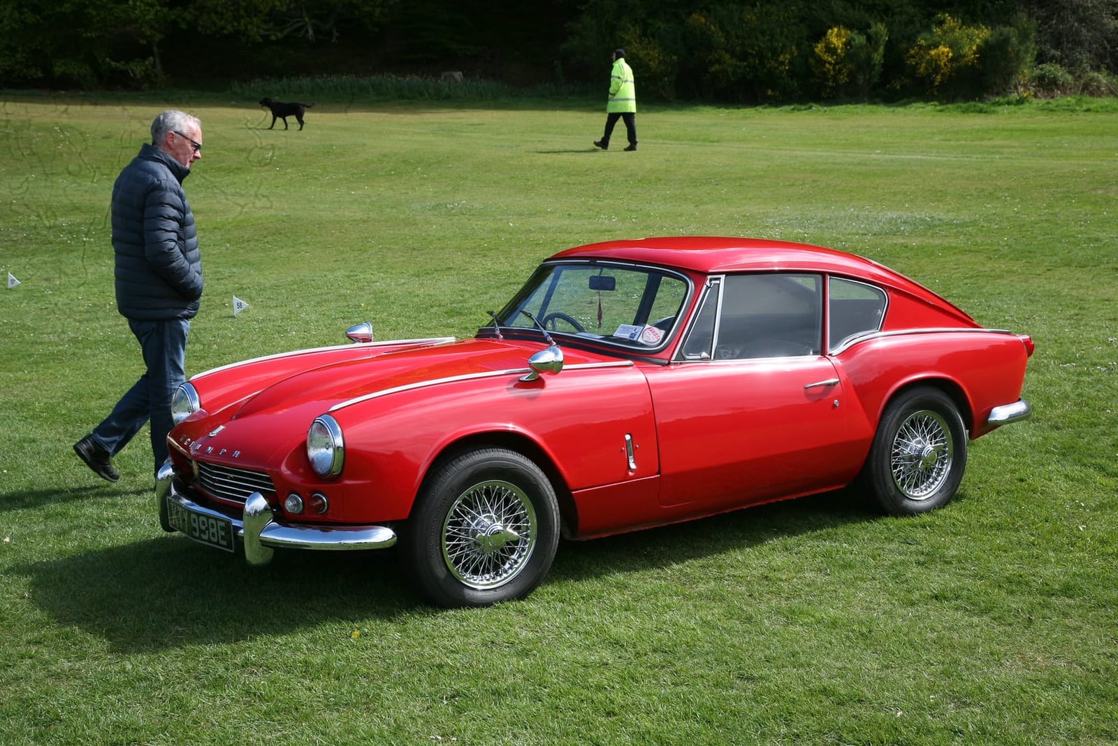 A red Triumph GT6 Mk1, side view at a show