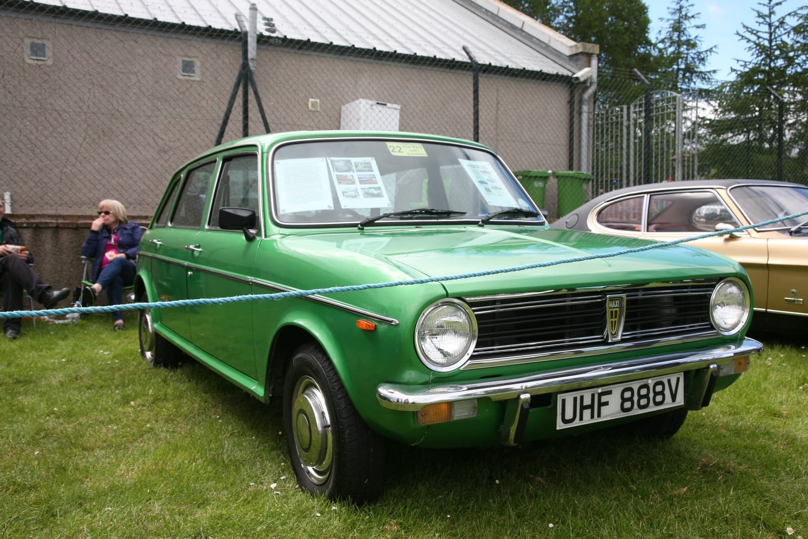 A green 1980 Austin Morris Maxi 1750 HLS on grass at a classic car show, front three-quarter view, UK registration UHF 888V