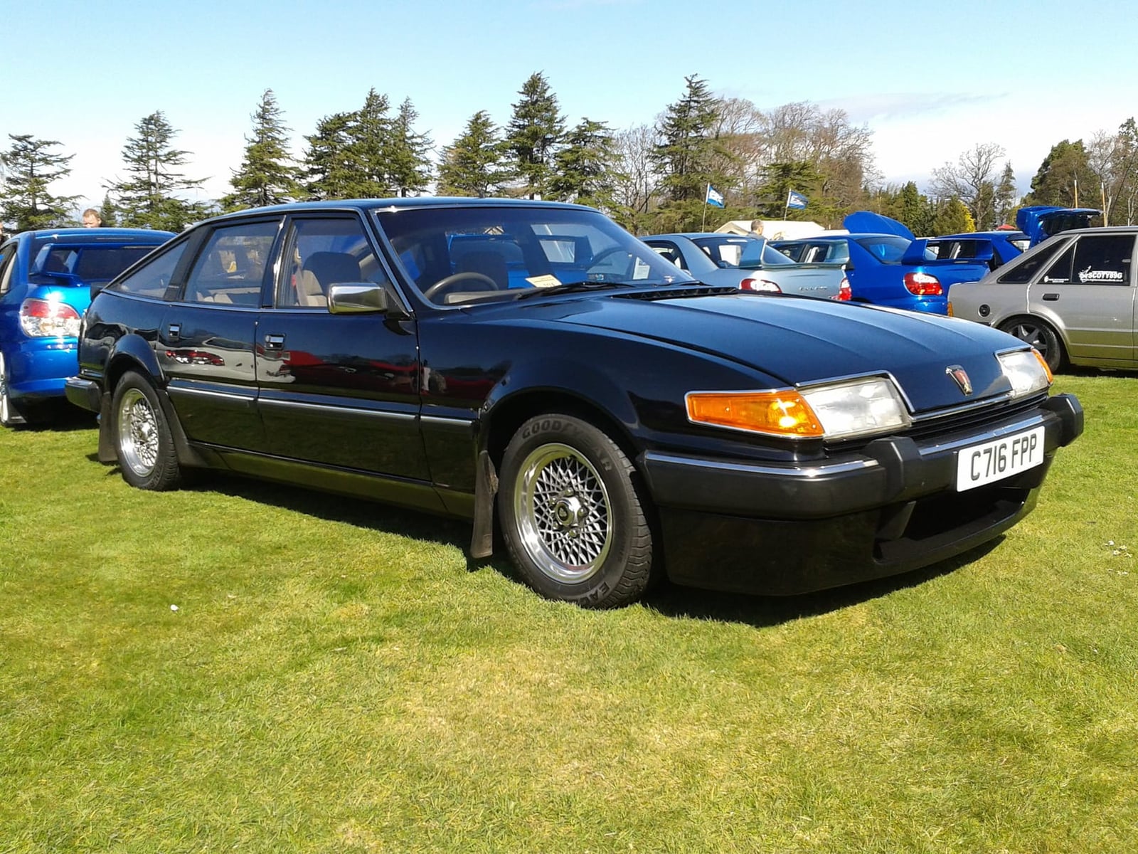 A black 1986 Rover SD1 at a classic car show, front three-quarter view, UK registration C716 FFF