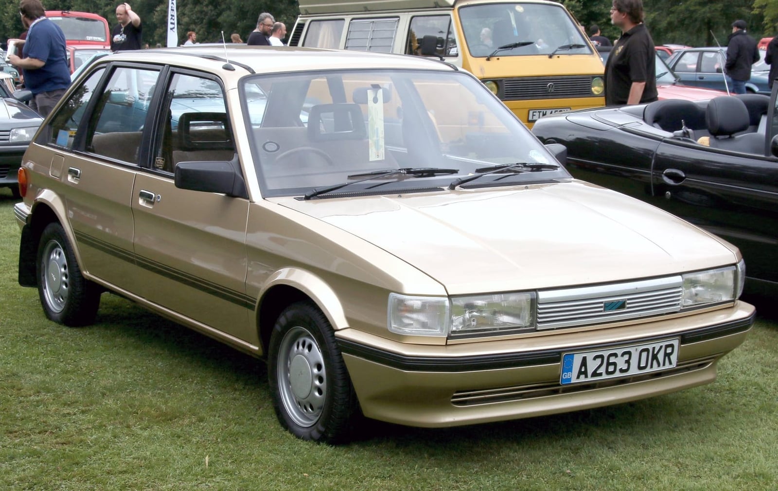A gold 1984 Austin Maestro 1.3 HLE with a UK registration on a show field