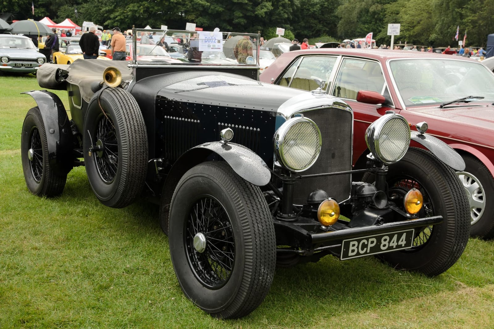 A black 1950 Bentley Mk VI special with vintage-style open bodywork and UK registration BCP 844