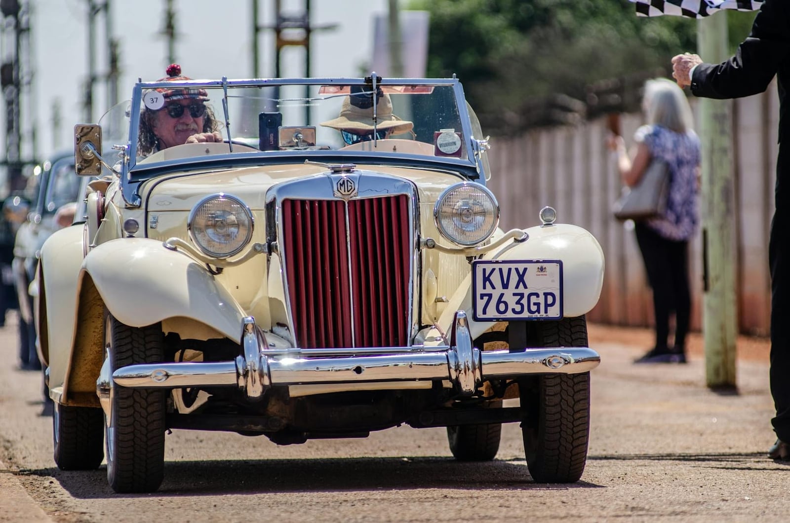 A cream MG TD on a classic car run, front three-quarter view