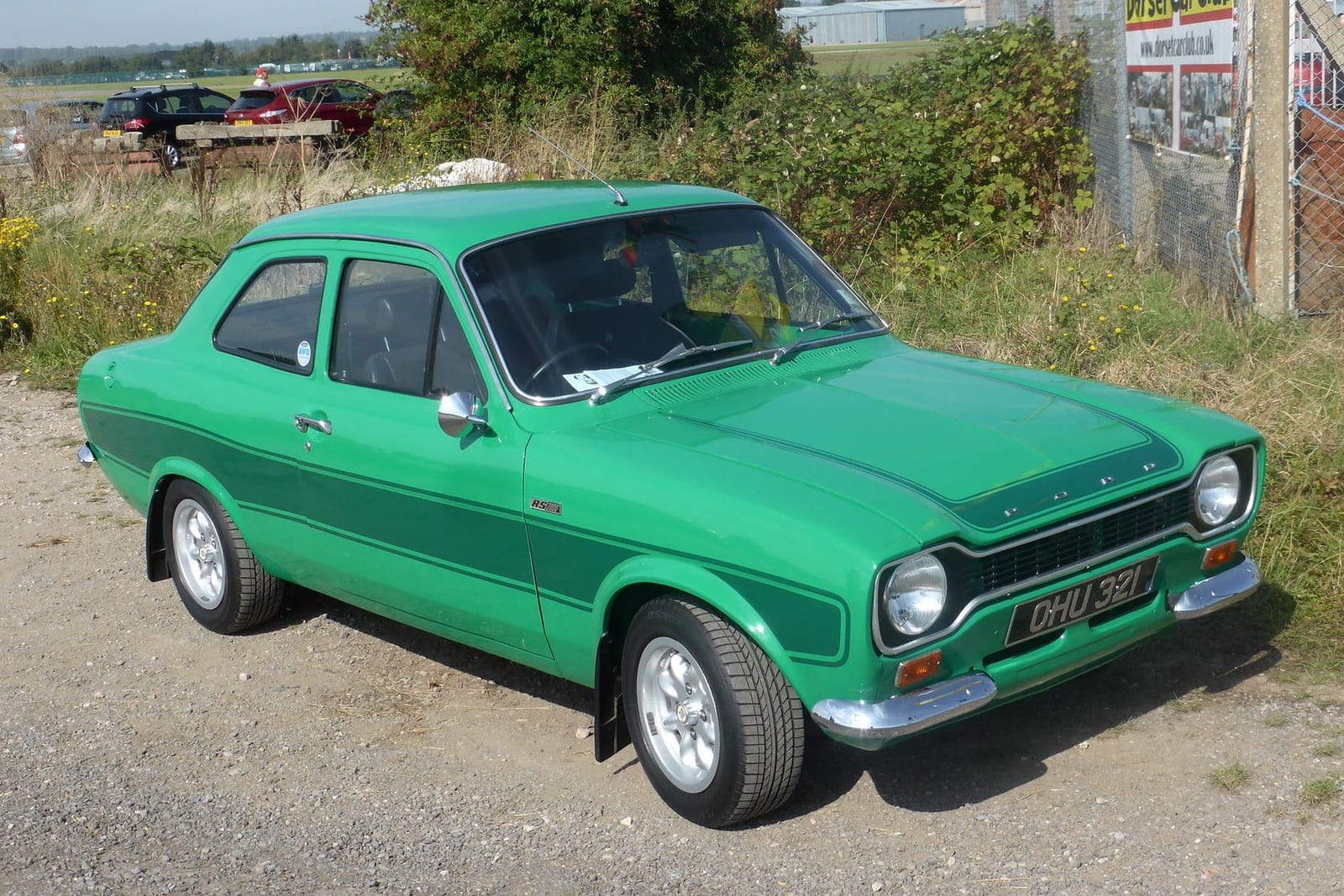 A green Mk1 Ford Escort RS2000, front three-quarter view