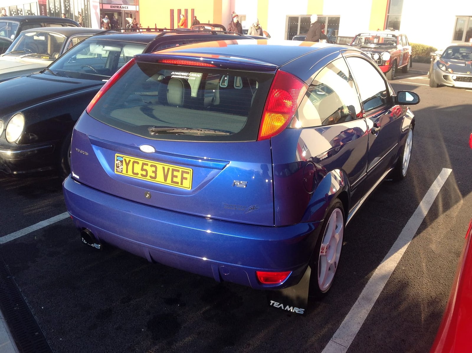 The rear of an Imperial Blue 2003 Ford Focus RS Mk1 with a UK registration in a car park