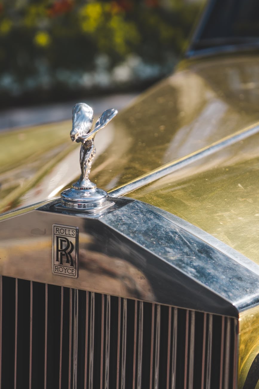 The grille and Spirit of Ecstasy of a gold Rolls-Royce Silver Cloud in close detail