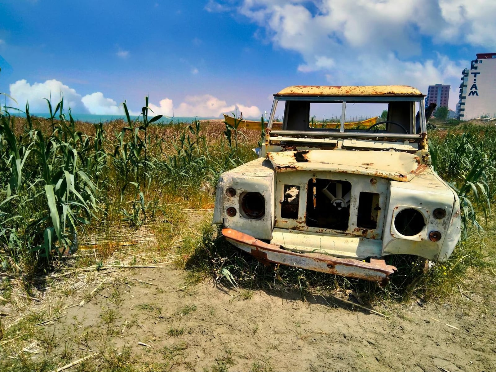 A stripped, rusting Land Rover Series shell awaiting restoration