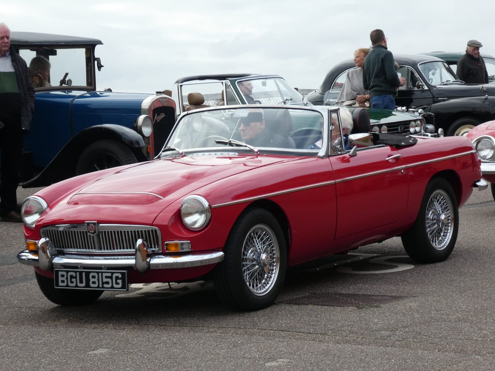 A red MG MGC roadster, front three-quarter view at a show
