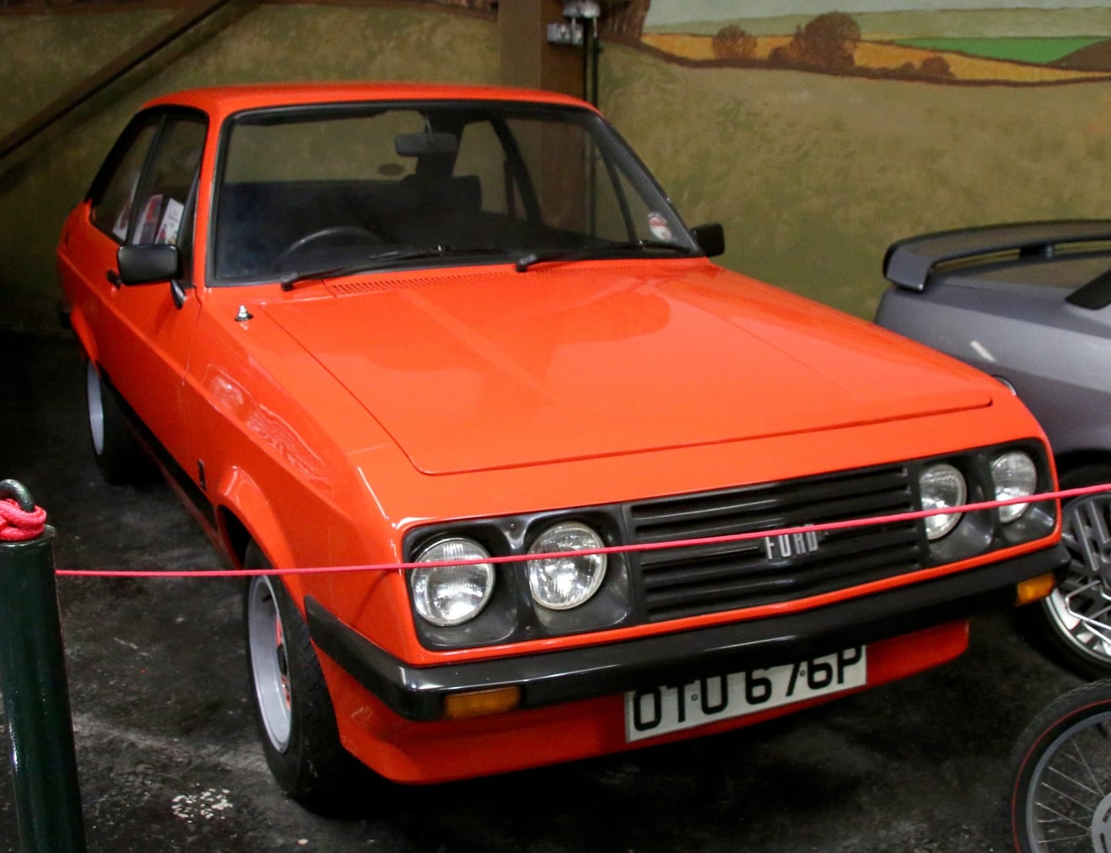 An orange Mk2 Ford Escort RS2000 with the droop-snoot nose, front three-quarter view