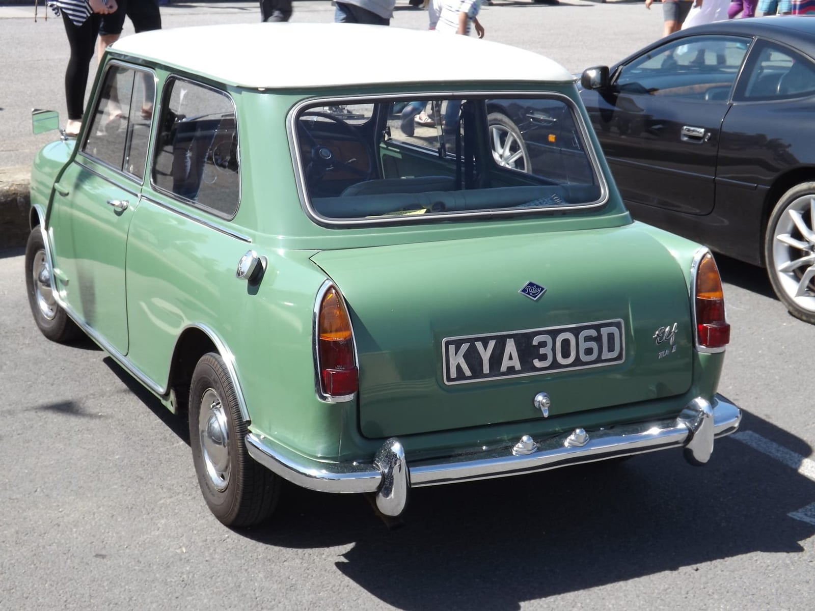 A green Riley Elf at a seaside show, rear three-quarter view