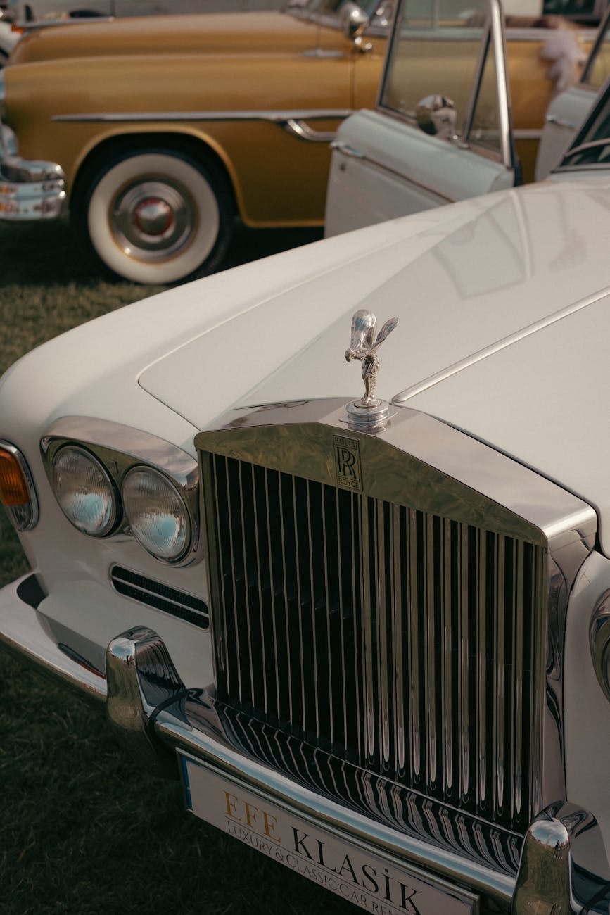 The Parthenon grille and Spirit of Ecstasy of a white Rolls-Royce Silver Shadow in close detail