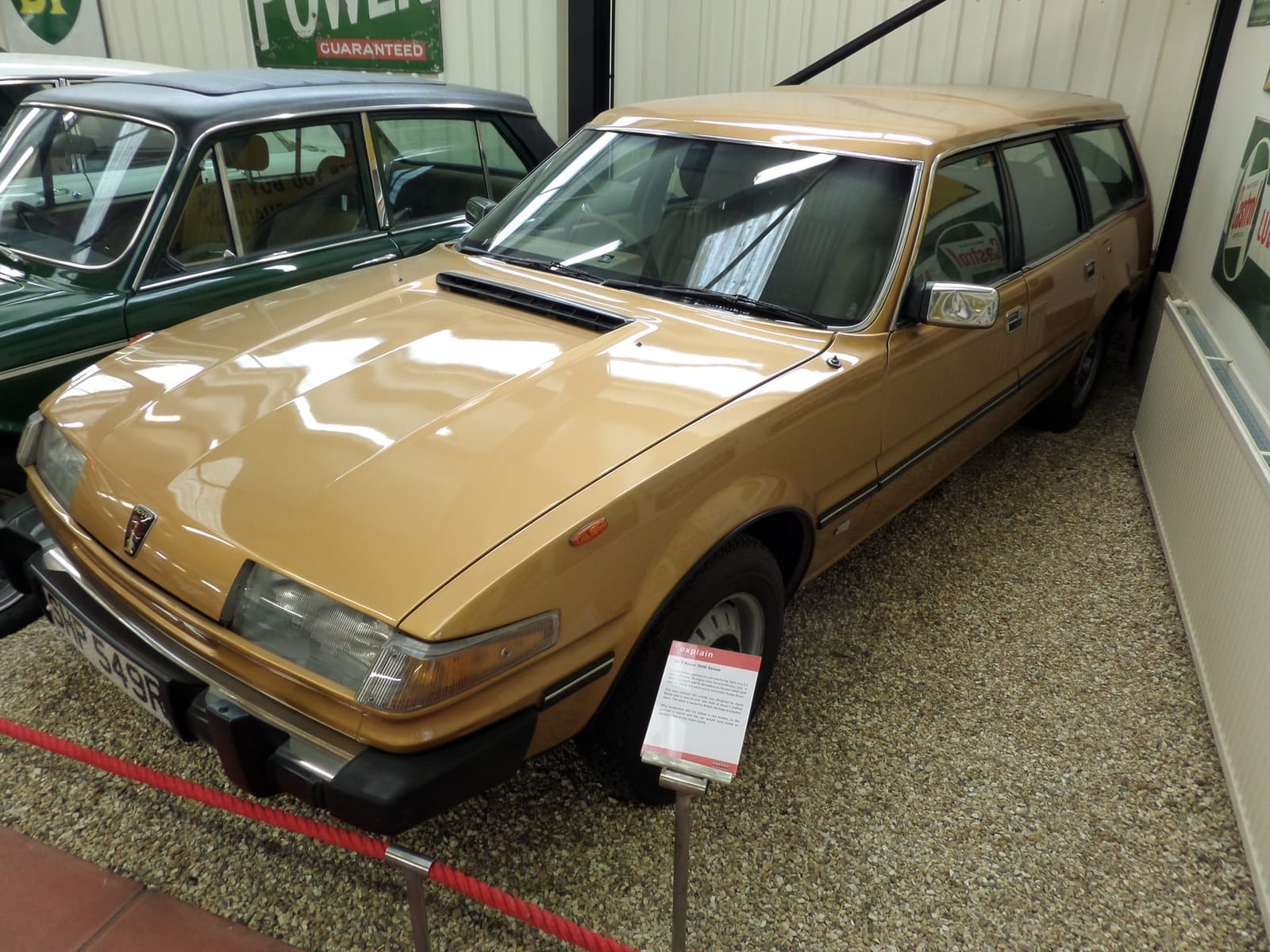 The gold 1977 Rover SD1 estate prototype on museum display, showing its extended roofline and rear side windows