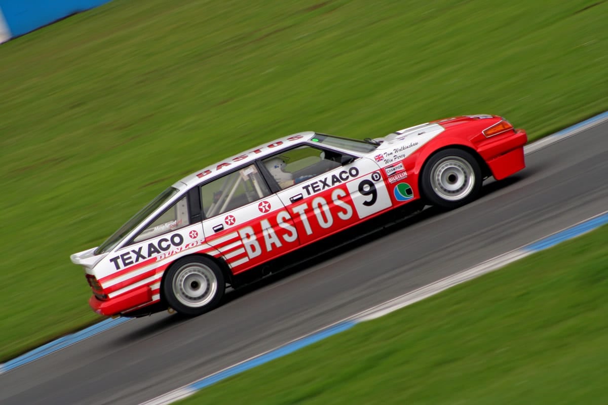 A red and white Texaco-liveried Rover SD1 racing saloon at speed on a circuit, race number 9