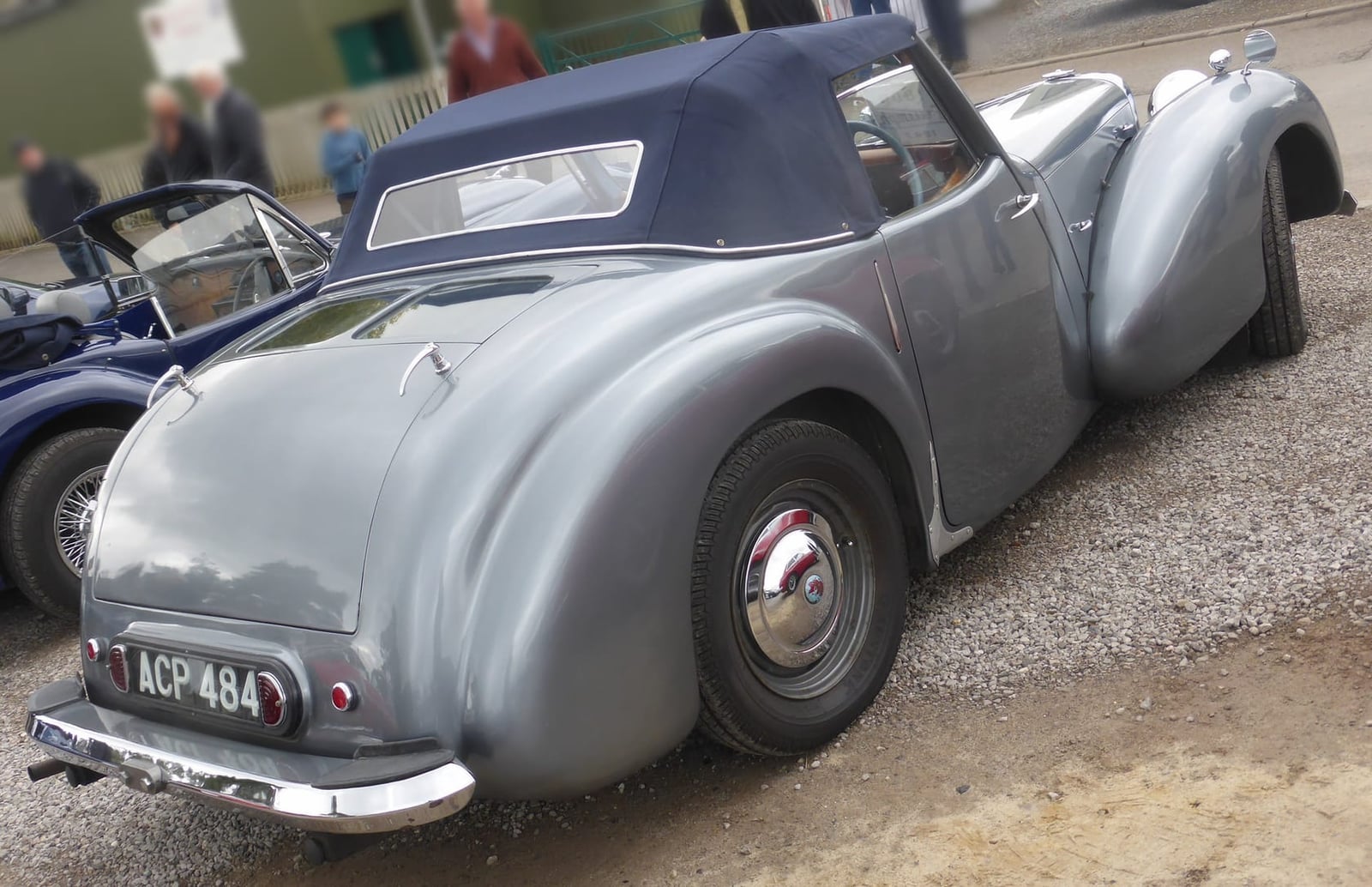 The rear of a grey 1947 Triumph 1800 Roadster showing the boot deck that houses the dickey seat