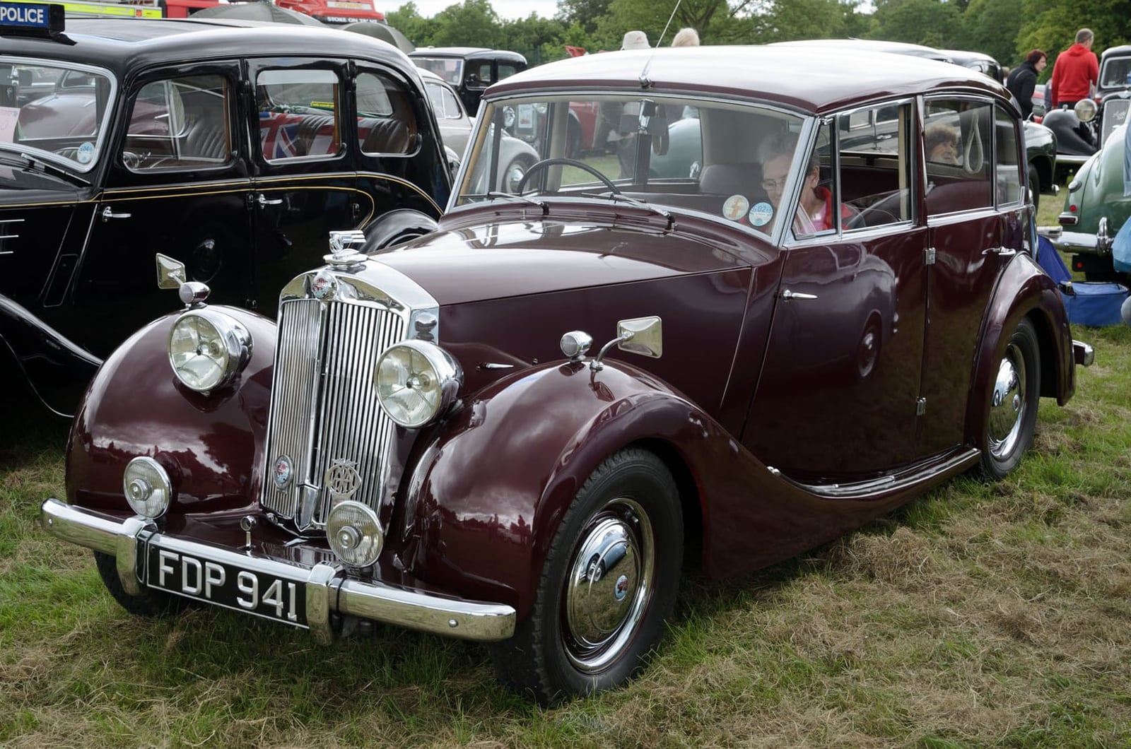 A maroon 1953 Triumph Renown with UK registration FDP 941 at a classic car show