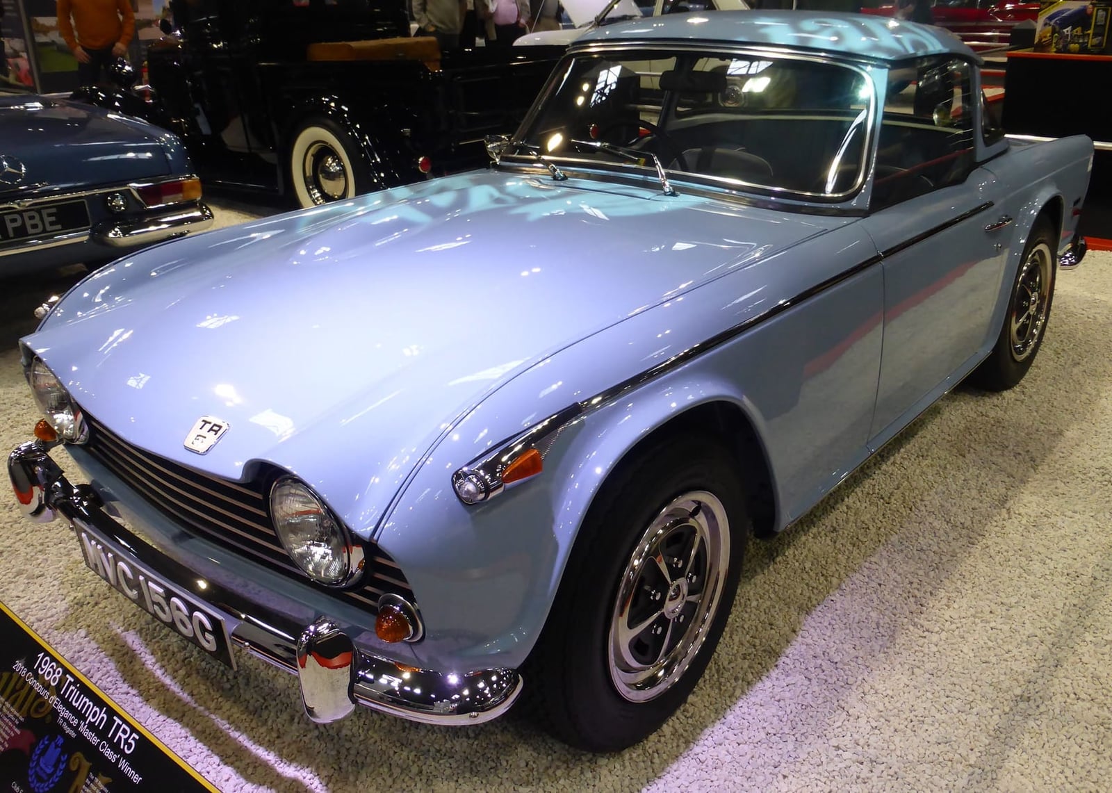 A pale blue Triumph TR5 PI, front three-quarter view
